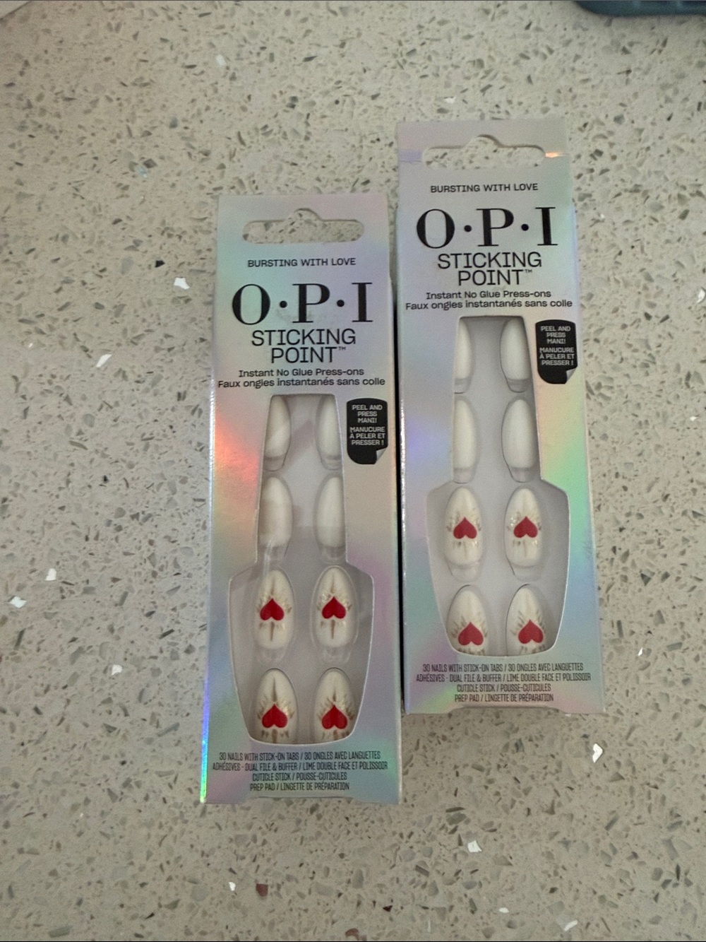 2 packs of OPI White Press-On Nails with Red Heart Accent
